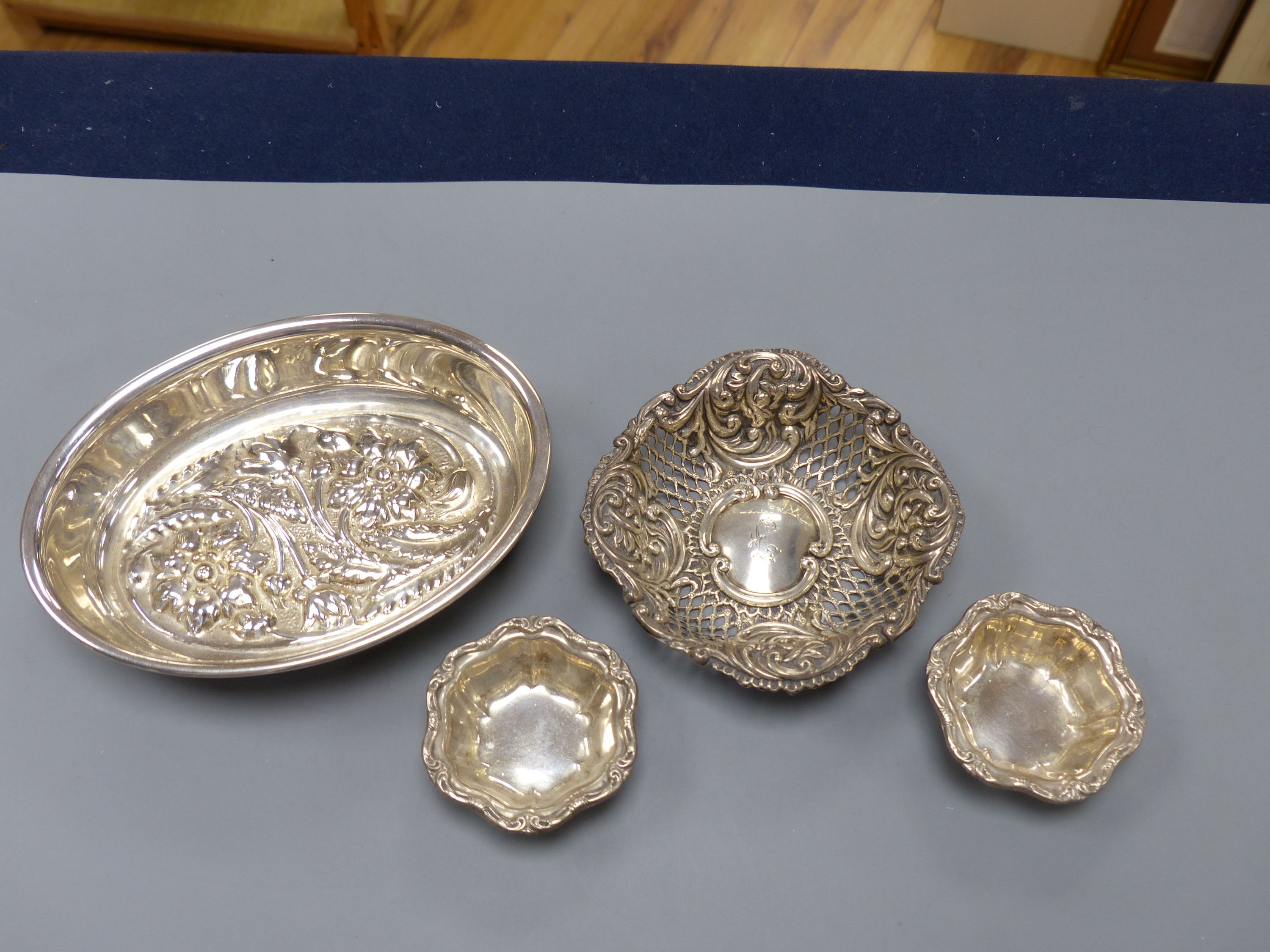 An Italian 8000 standard white metal oval bowl, 15.8cm, two small Birks sterling salts and a repousse silver bonbon dish